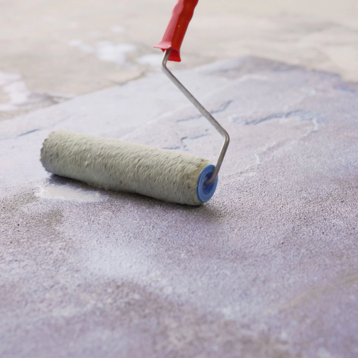 close up of a roller during a concrete sealing menan id
